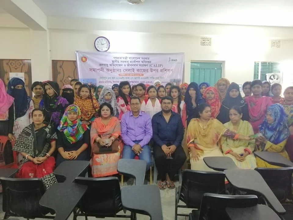 A group photo at the close of a sewing training course