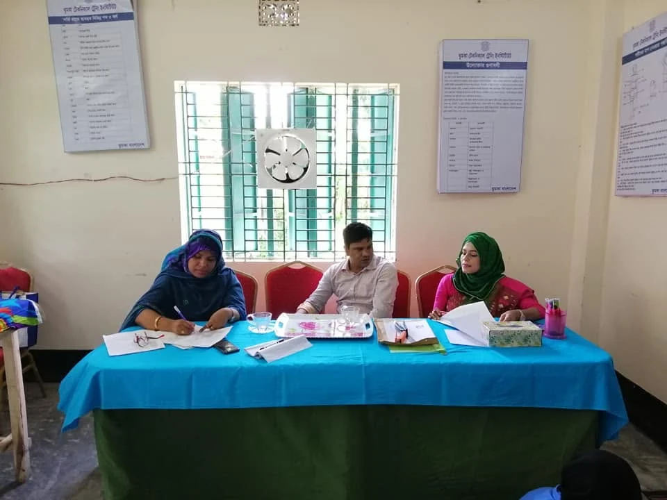 Staff at the registration desk before a training session